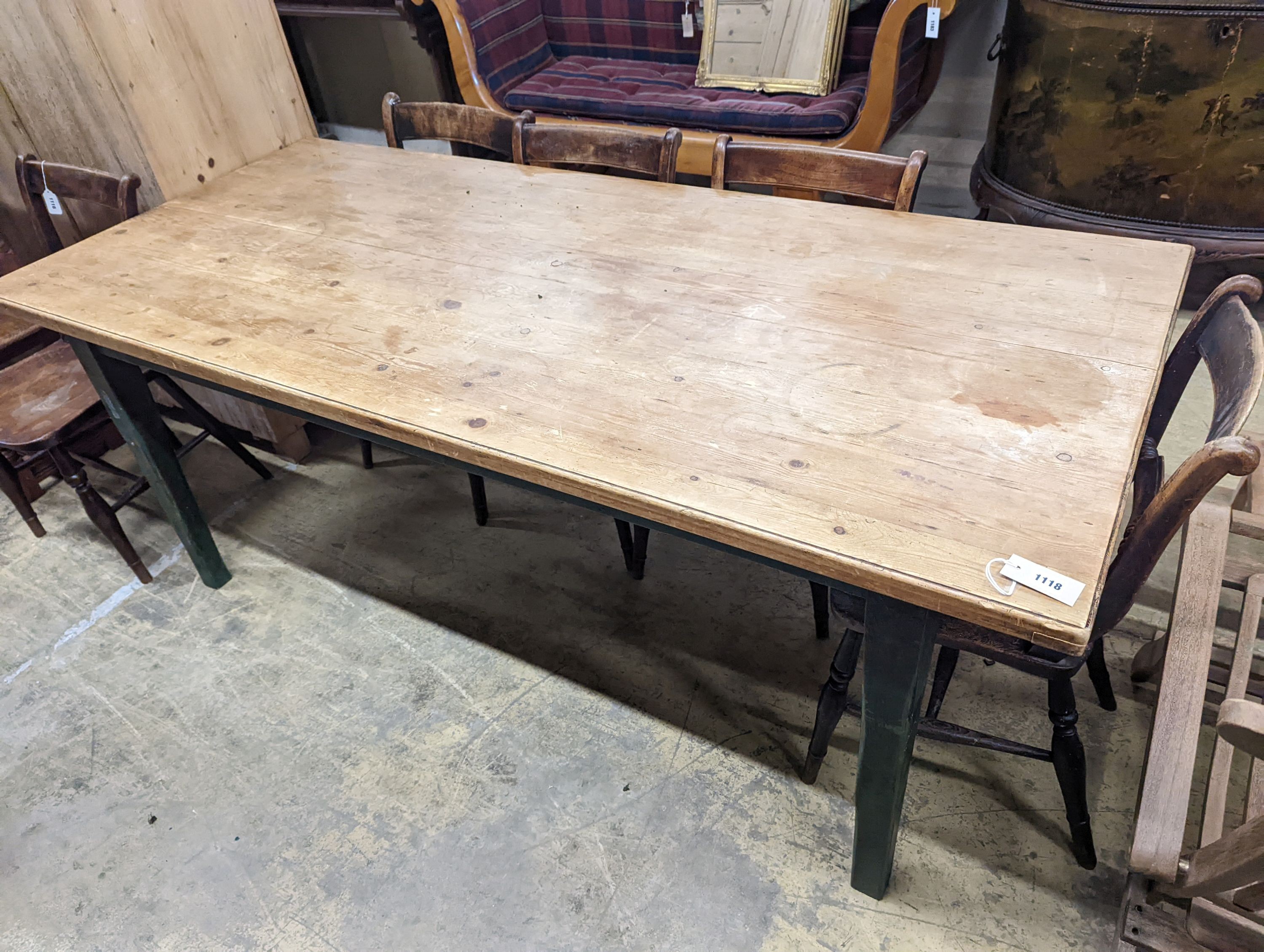 A rustic farmhouse pine kitchen table with painted legs, length 192cm, depth 85cm, height 76cm